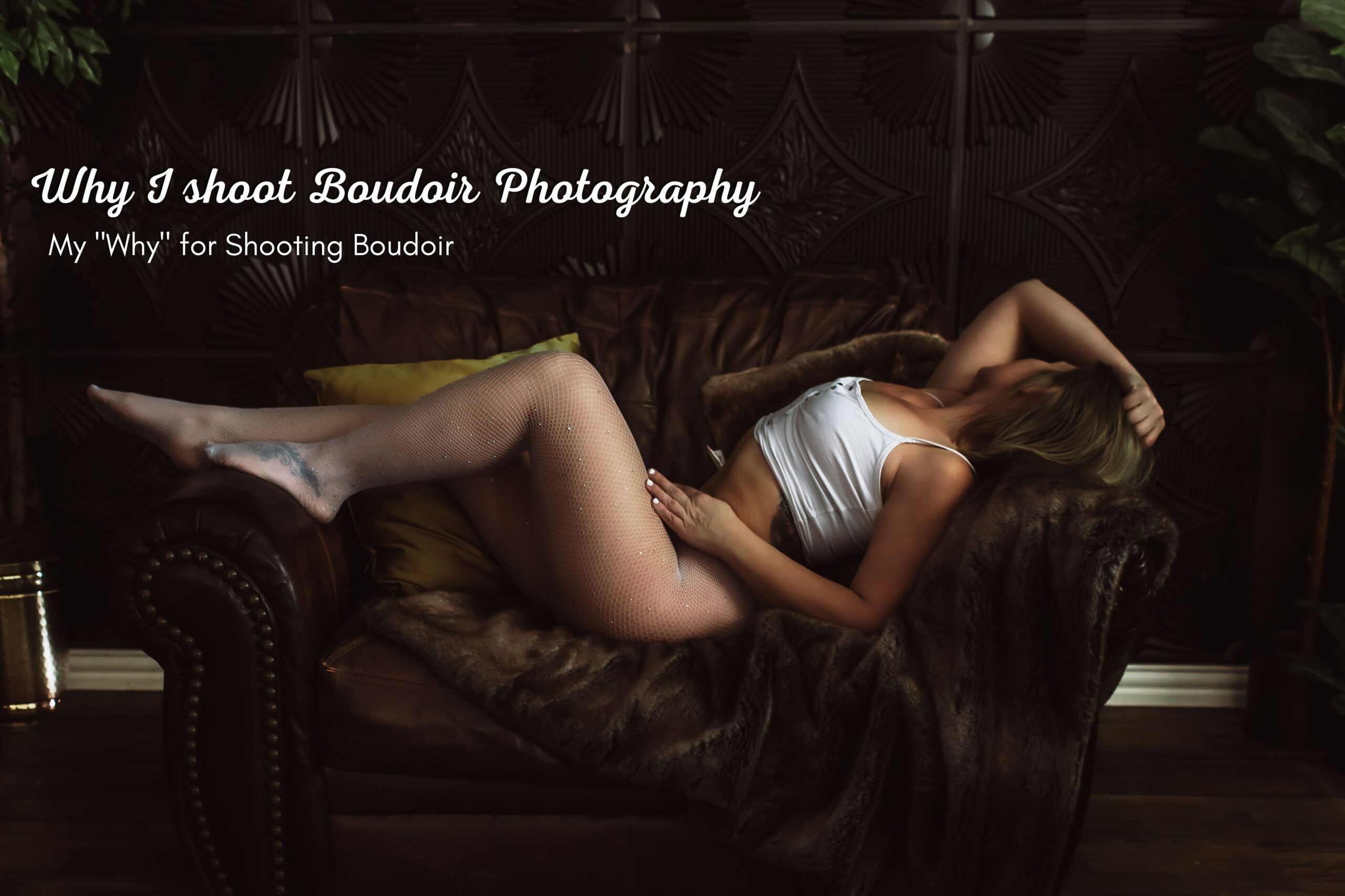boudoir pose on a brown leather chair